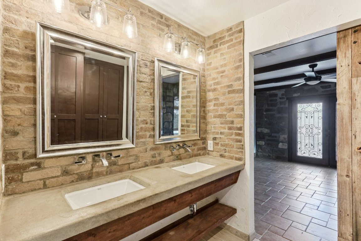 24369-2 Bingham Creek Road, Unit 12 Leander, TX 78641 - Photo 13 of 22 a bathroom with a sink and a mirror