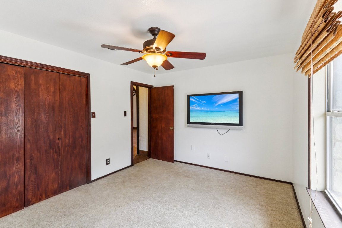 24369-2 Bingham Creek Road, Unit 12 Leander, TX 78641 - Photo 19 of 22 a view of a living room with a flat screen tv