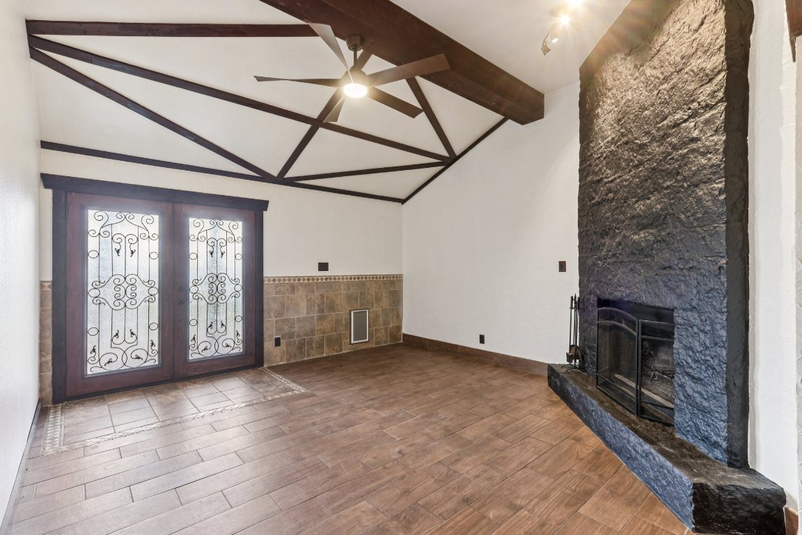 24369-2 Bingham Creek Road, Unit 12 Leander, TX 78641 - Photo 2 of 22 a view of an empty room with a fireplace and a window