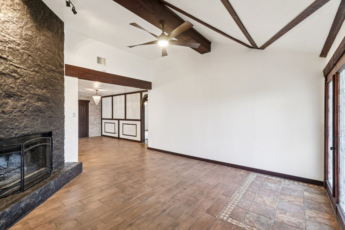24369-2 Bingham Creek Road, Unit 12 Leander, TX 78641 - Photo 4 of 22 a view of an empty room with a fireplace and a window