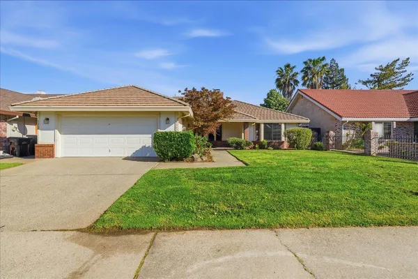 front view of house with a yard