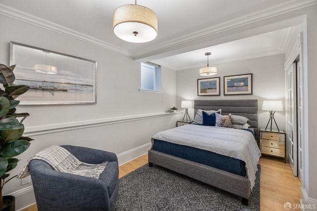 a bedroom with a bed and lamp