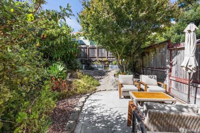 a front view of a residential apartment building with a yard