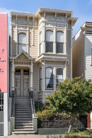 front view of a house with a tree