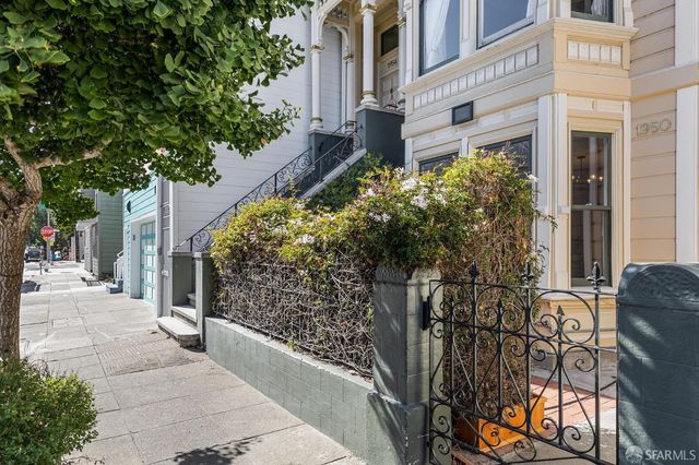 front view of a house with a large window