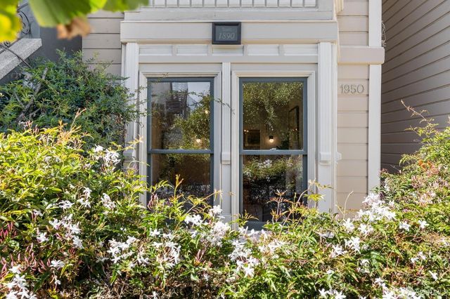 a view of a chairs and table in backyard