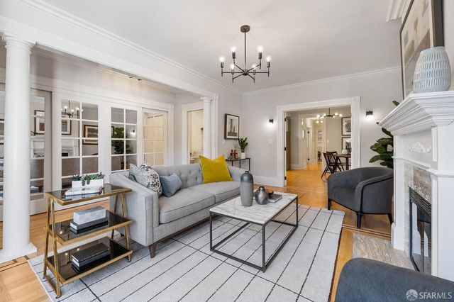 a living room with furniture and windows
