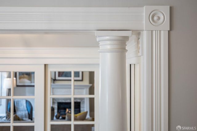 a living room with furniture fireplace and a table