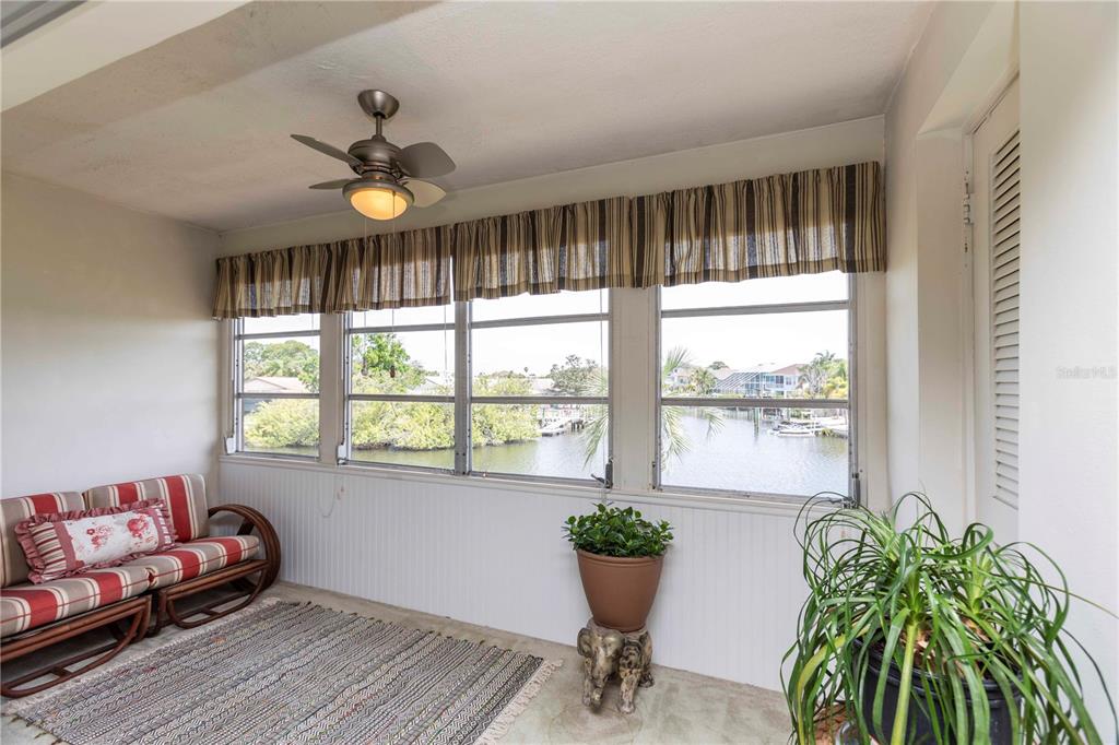 4609 Marine Parkway, Unit 203 New Port Richey, FL 34652 - Photo 3 of 25 a living room with furniture and a potted plant
