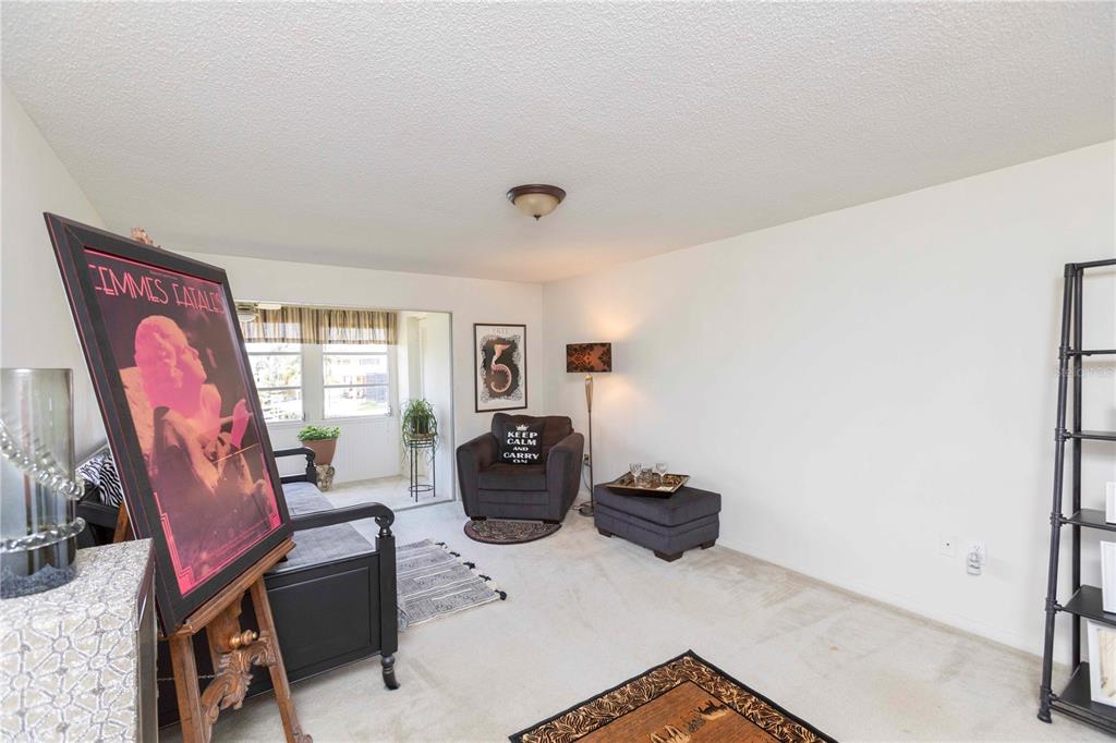 4609 Marine Parkway, Unit 203 New Port Richey, FL 34652 - Photo 7 of 25 a livingroom with workspace and a window