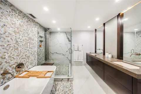 a bathroom with a sink and a large mirror
