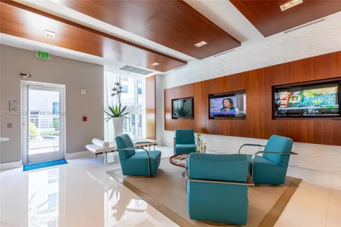 a room with furniture and a large window