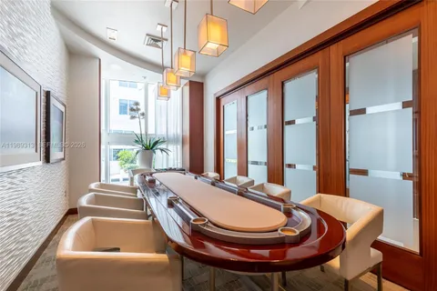 a dining room with furniture and window