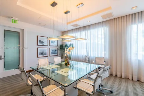 a front view of a multi story building with yard