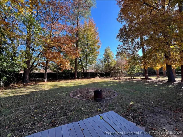 a view of a yard with trees