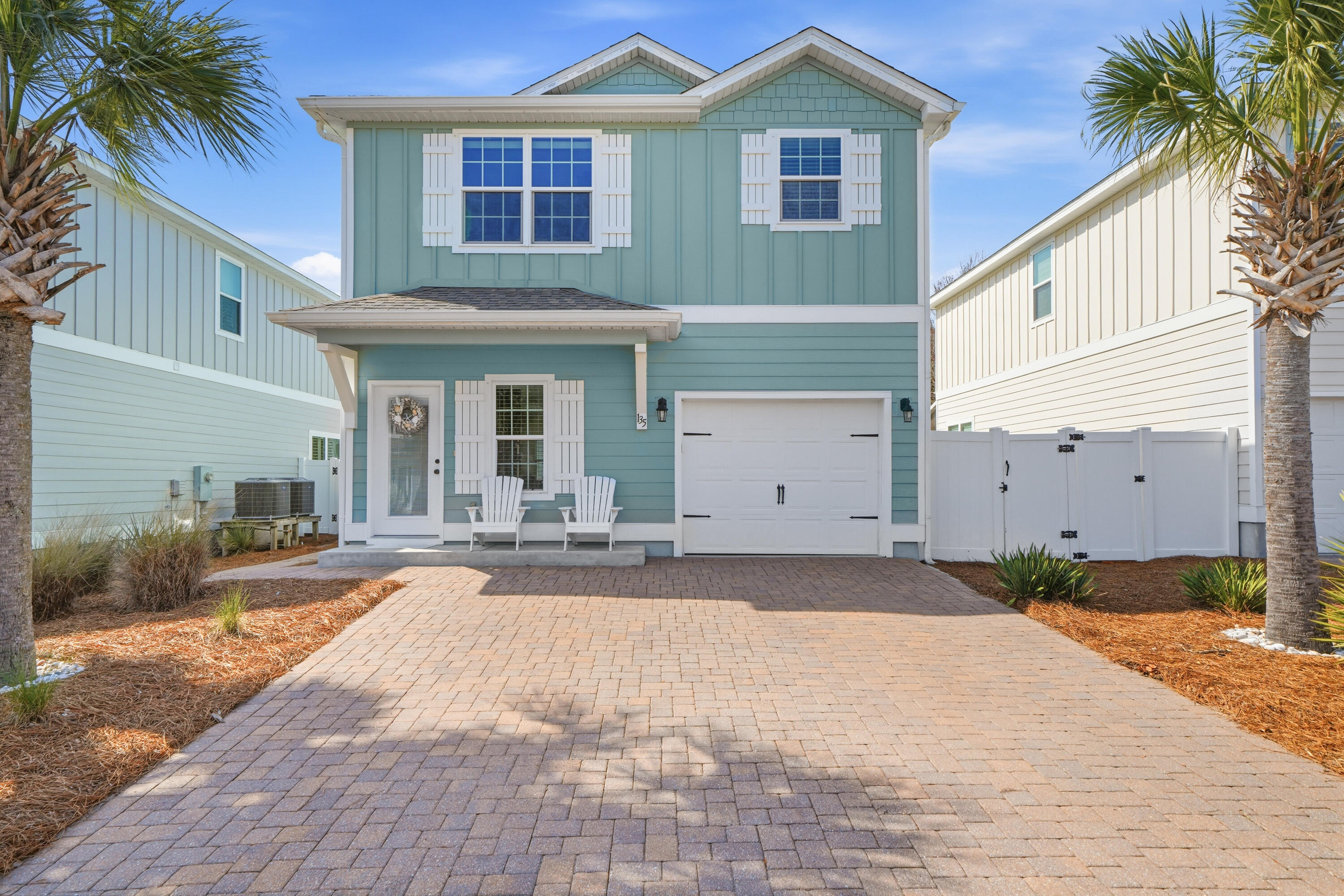 135 Grayling Way Inlet Beach, FL 32461 - Photo 44 of 61 a front view of a house with a yard and garage