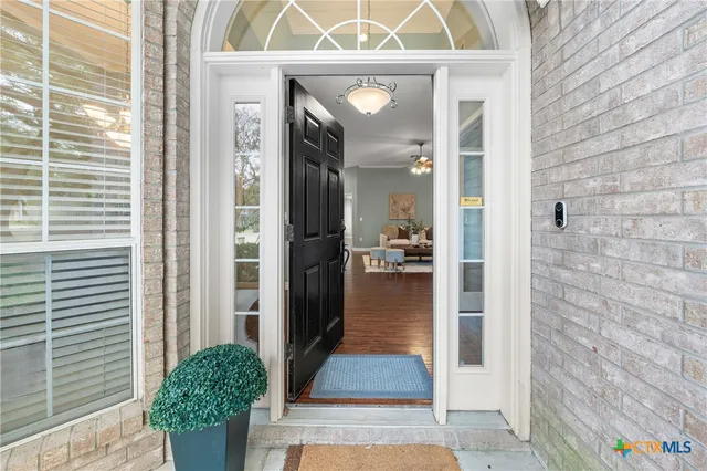 a view of a hallway with a outdoor space