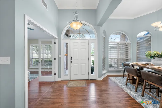 a view of a livingroom with furniture window and wooden floor