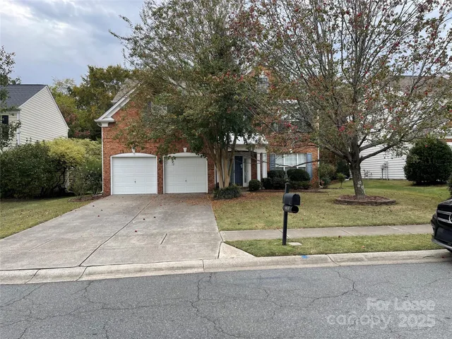 a street sign on a sidewalk next to road