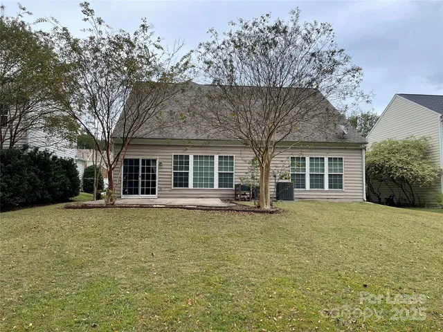 front view of a house with a garden