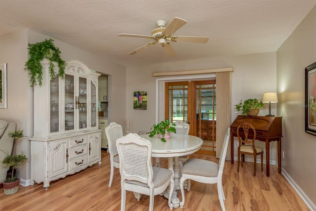 3184 Brunswick Circle Palm Harbor, FL 34684 - Photo 15 of 57 a view of a dining room with furniture window and wooden floor