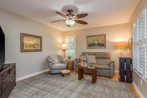 a dining room with furniture and wooden floor
