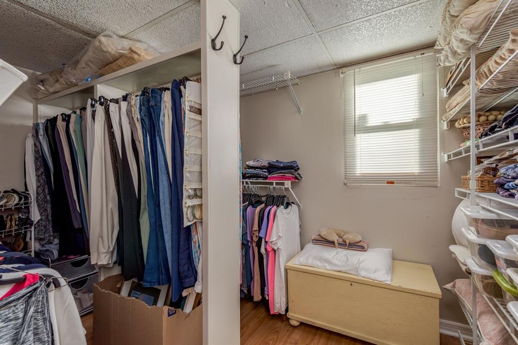 3184 Brunswick Circle Palm Harbor, FL 34684 - Photo 27 of 57 a view of walk in closet with clothes and shoes