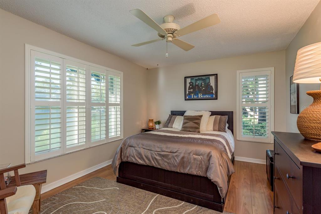 3184 Brunswick Circle Palm Harbor, FL 34684 - Photo 29 of 57 a bedroom with a bed window and a chair