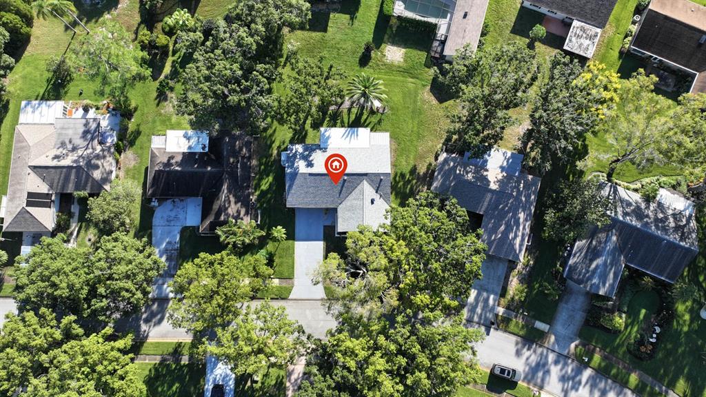 3184 Brunswick Circle Palm Harbor, FL 34684 - Photo 41 of 57 an aerial view of house with yard and outdoor seating