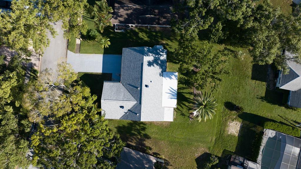 3184 Brunswick Circle Palm Harbor, FL 34684 - Photo 42 of 57 an aerial view of a house with a yard