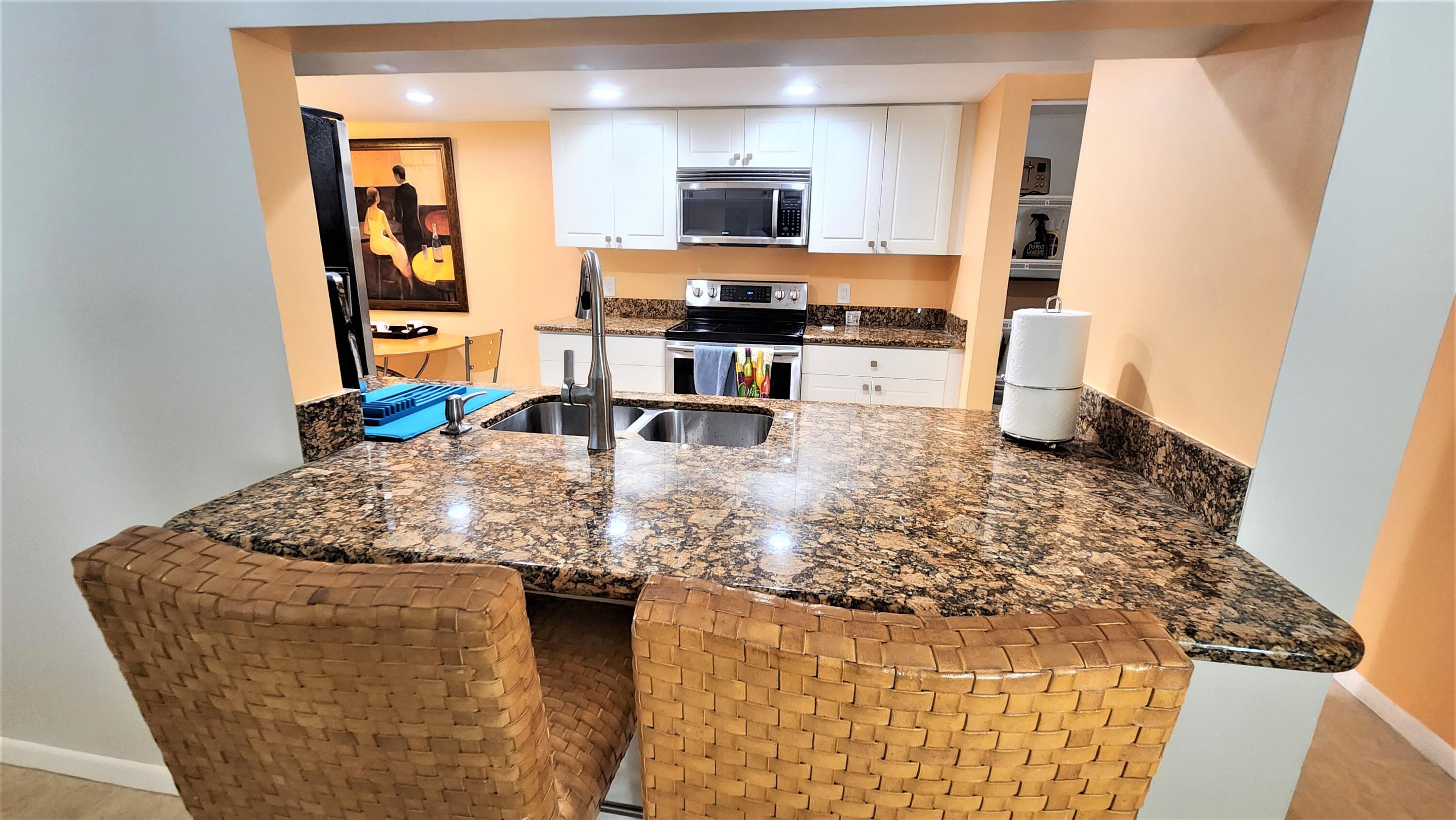 1915 Lavers Circle, Unit E208 Delray Beach, FL 33444 - Photo 5 of 20 kitchen