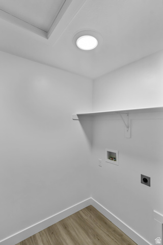 3014 South 265th Street West Logan, UT 84321 - Photo 18 of 25 Dedicated utility space featuring light wood-finish flooring, white baseboards, and bright overhead lighting