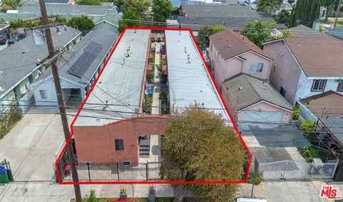 an aerial view of house with sign board