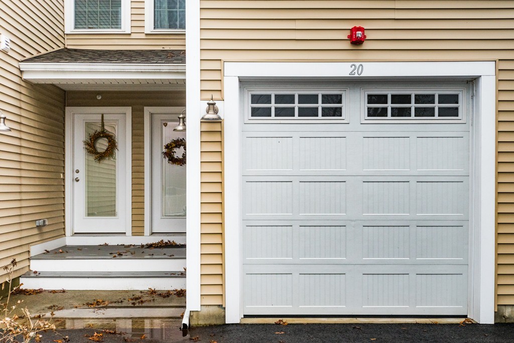 143 Broad Street, Unit 20 Hudson, MA 01749 - Photo 1 of 30 front view of a house with a windows