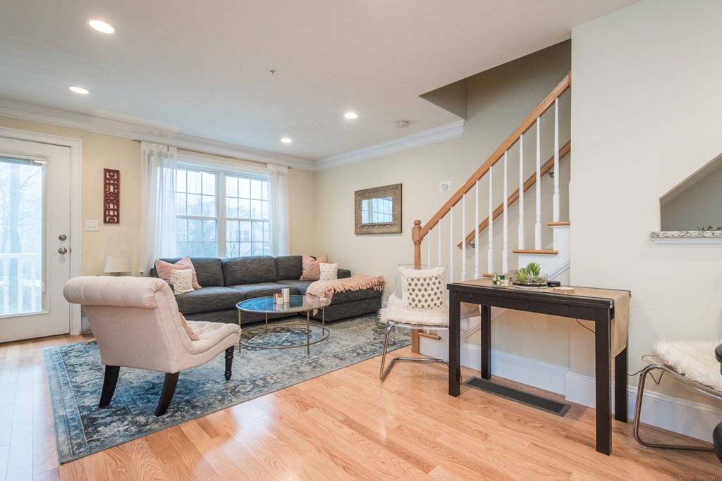 143 Broad Street, Unit 20 Hudson, MA 01749 - Photo 3 of 30 a living room with furniture and a window