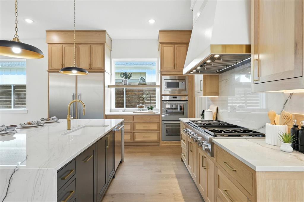 7618 Roper Street Dallas, TX 75209 - Photo 15 of 35 a kitchen with stainless steel appliances a sink stove and cabinets