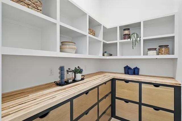 a kitchen with a cabinets and window