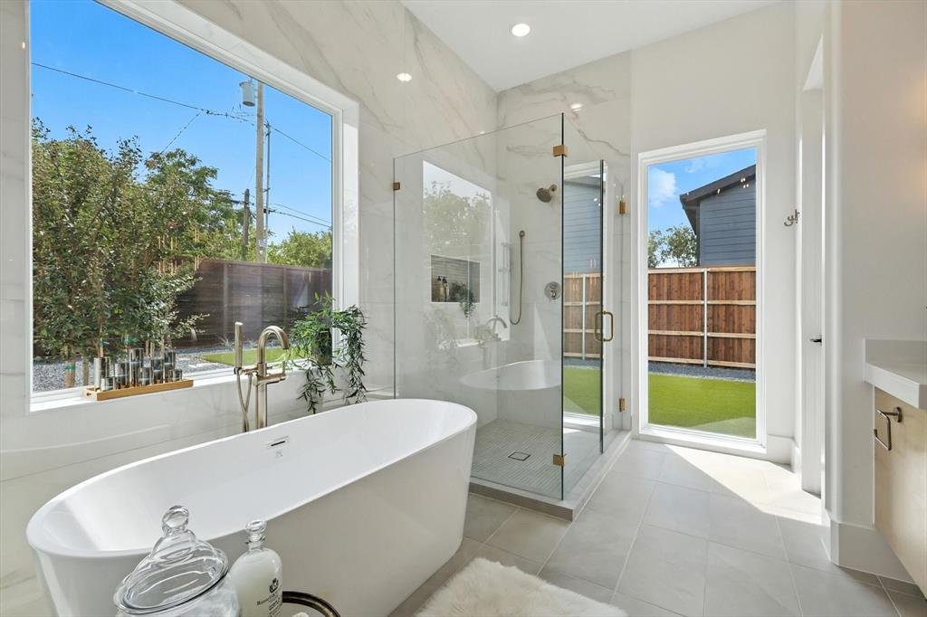 7618 Roper Street Dallas, TX 75209 - Photo 20 of 35 a bathroom with a tub and shower