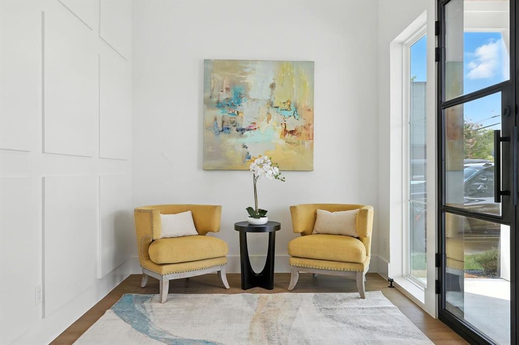 7618 Roper Street Dallas, TX 75209 - Photo 2 of 35 a bedroom with a bed and a painting on the wall