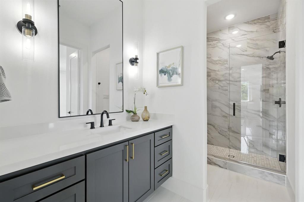 7618 Roper Street Dallas, TX 75209 - Photo 27 of 35 a bathroom with a double vanity sink mirror and shower