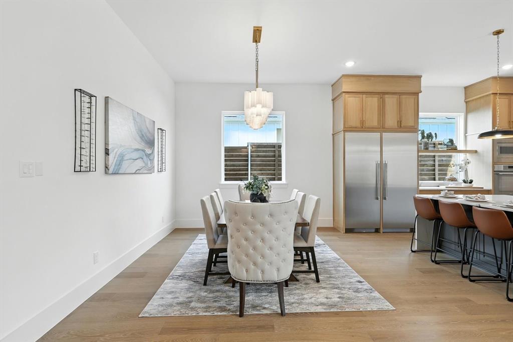 7618 Roper Street Dallas, TX 75209 - Photo 29 of 35 a view of a dining room with furniture window and wooden floor