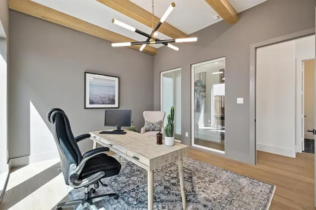 a work room with furniture and a rug