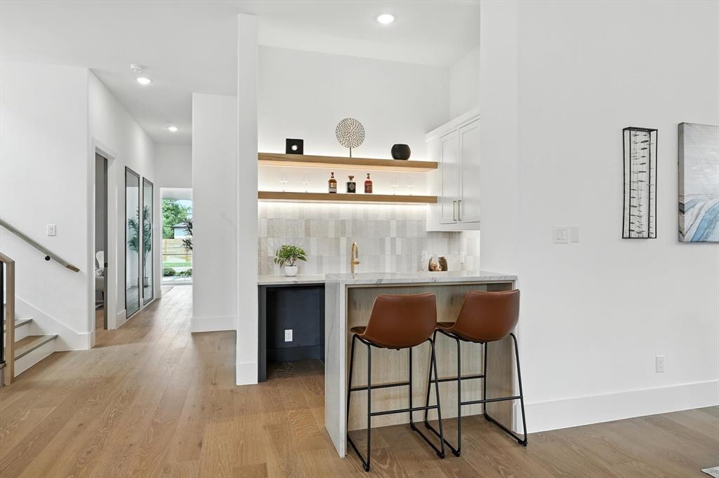 7618 Roper Street Dallas, TX 75209 - Photo 8 of 35 a living room with furniture and a wooden floor