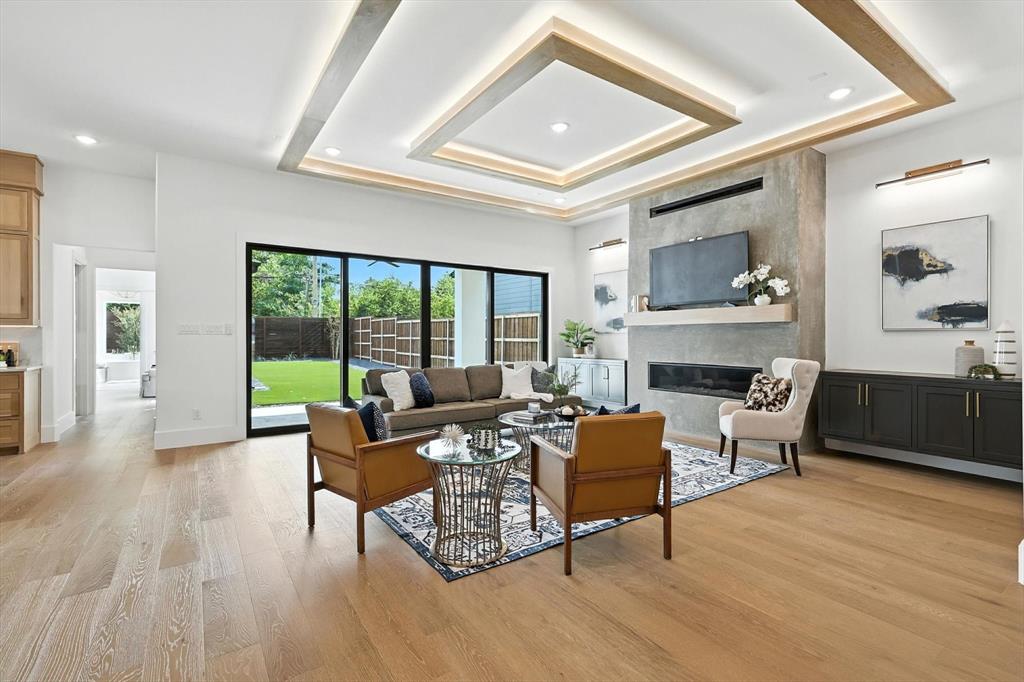 7618 Roper Street Dallas, TX 75209 - Photo 9 of 35 a living room with furniture and a fireplace