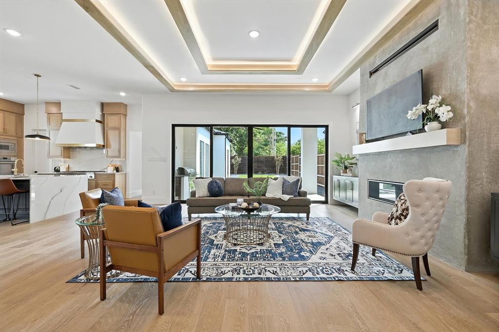 7618 Roper Street Dallas, TX 75209 - Photo 10 of 35 a living room with furniture and a fireplace