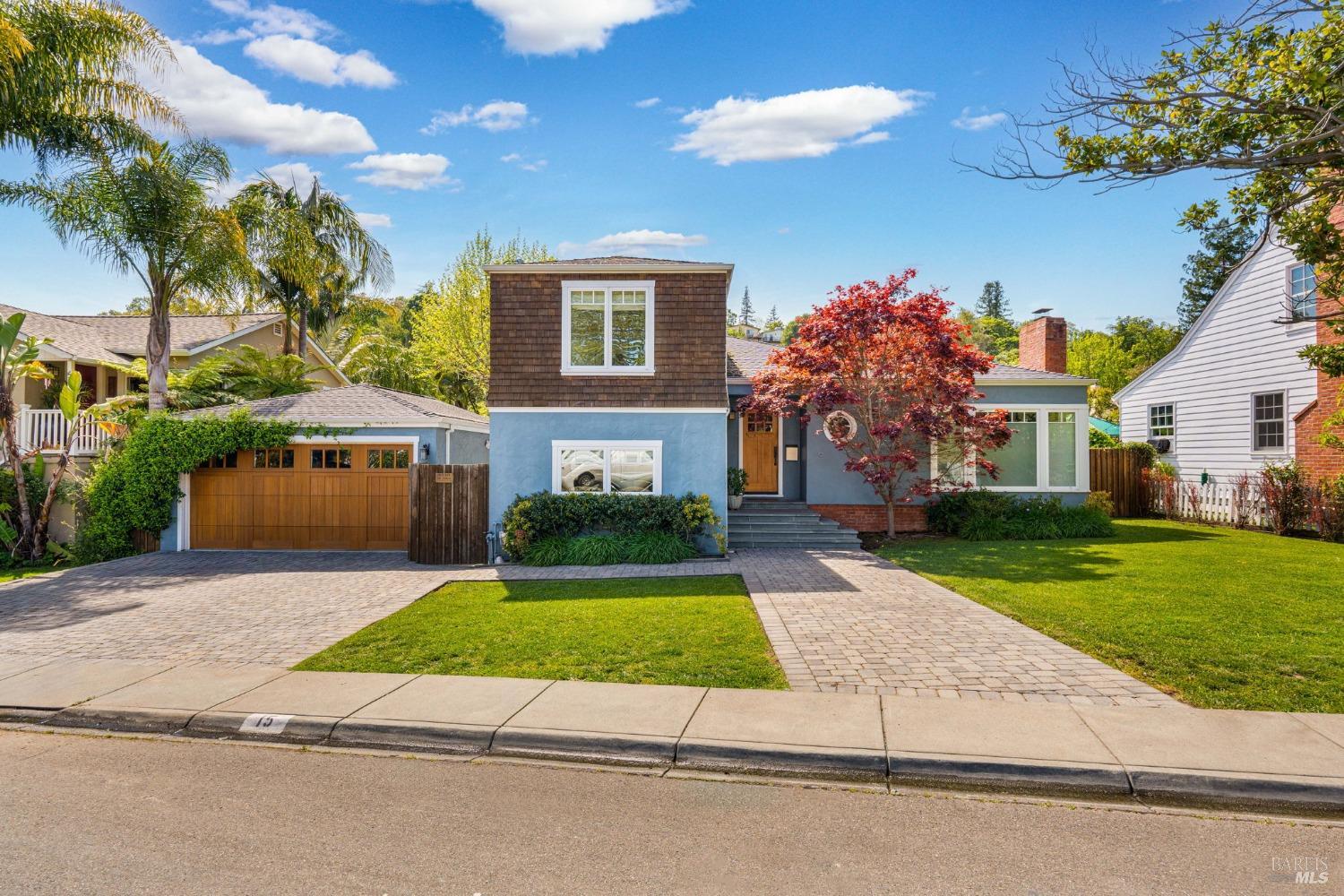 15 Valley Road San Anselmo, CA 94960 - Photo 1 of 1 a front view of a house with a yard and garage