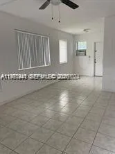 a view of a livingroom with wooden floor