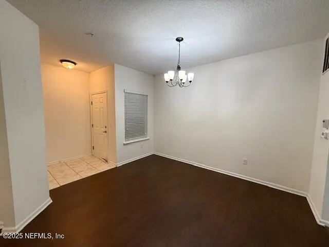 an empty room with a mirror