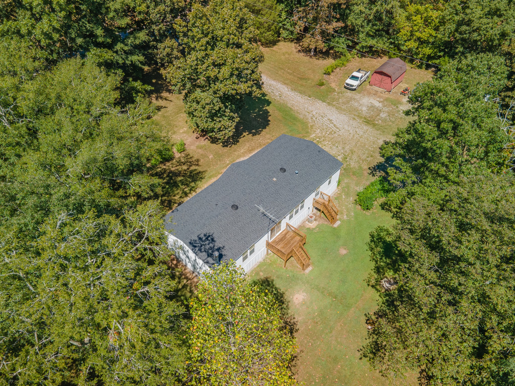 5085 Flat Creek Road Spring Hill, TN 37174 - Photo 12 of 17 an aerial view of residential house with outdoor space and trees all around