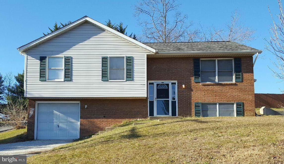 6624 Ridge Road Eldersburg, MD 21784 - Photo 2 of 20 a front view of a house with a garden